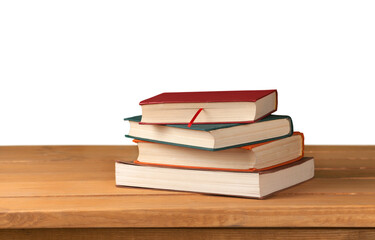 Stack of books on table isolated on white background