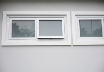 Small pane windows are installed to ventilate the house.