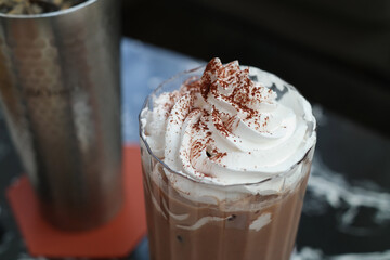 Chocolate drink topped with white foam