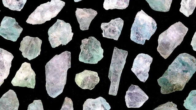 Apatite rare jewel stones filled texture on white light isolated background. Moving right seamless loop backdrop.