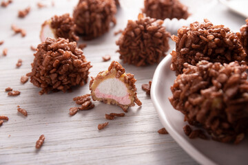 Homemade Caramel Marshmallows covered in chocolate flavor puffed rice, sweet treat easy to make, no baking required, ideal for parties and festivities