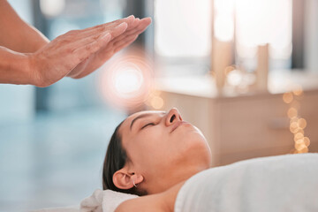 Obraz na płótnie Canvas Reiki, energy and light with head of woman in spa for alternative medicine, spiritual healing or traditional massage. Relax, wellness and peace with hands of healthcare expert for holistic treatment