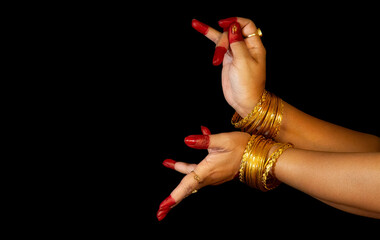 Indian classical dance hand mudras or gestures demonstrated by female Bharatanatyam dancer. 