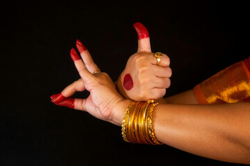 Indian classical dance hand mudras or gestures demonstrated by female Bharatanatyam dancer. 