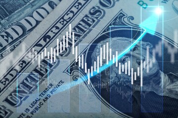 Glowing graph and money bills on computer