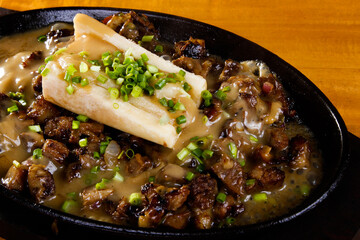 Sizzling beef kansi with bone marrow - a variant of a popular dish from the Visayas region of the Philippines