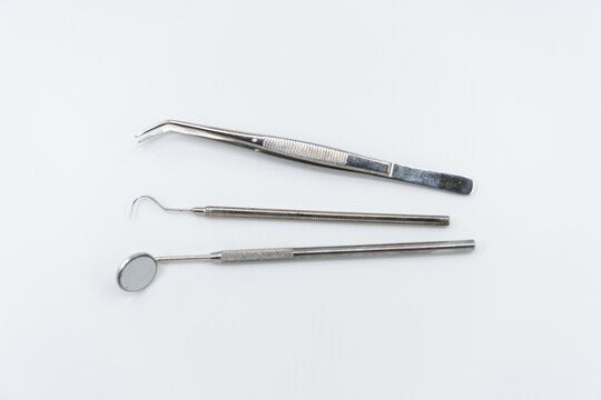 Professional dental instruments on white background