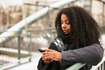 Woman reading fake news on cell phone