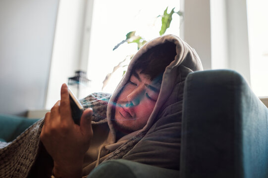 Man reading fake news on cell phone