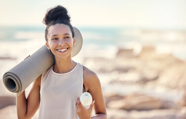 Happy black woman, fitness and smile for yoga in preparation for training, exercise or workout at the beach. Female smiling in spiritual wellness holding sports mat for calm, zen and exercising day