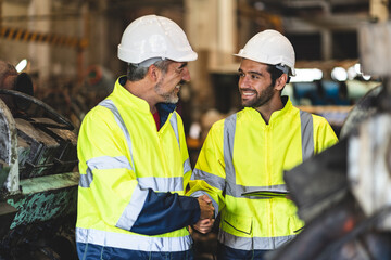 professional technician engineer with safety hard hat working to maintenance construction equipment in industrial factory, inspection man having manufacturing occupation job of production technology