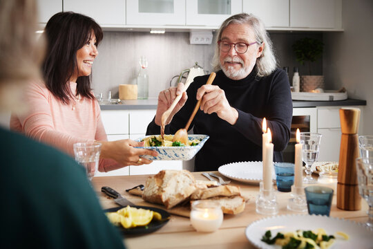 Family eating dinner at home together