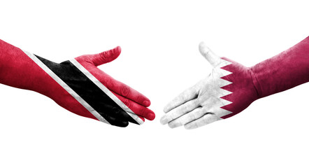 Handshake between Qatar and Trinidad Tobago flags painted on hands, isolated transparent image.