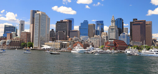 Boston skyline and harbor with boats and Atlantic Ocean on the foreground, USA