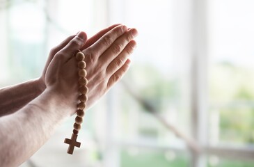 Person's hands praying, religion concept