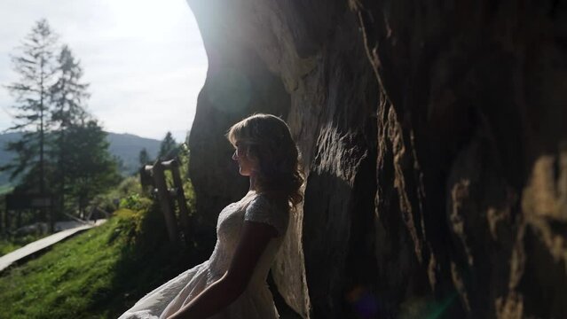 Loving couple kissing and hugging on coast on summer day outdoors.