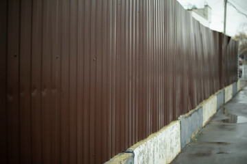 Steel fence in detail. Fence made of metal profile. Durable material to protect against prying eyes.