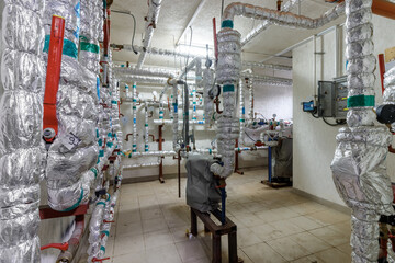 Household boiler house with heat pump, barrel, Valves, Sensors and an automatic control unit.