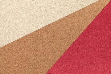 Texture of old craft beige, brown and red color paper background, macro. Structure of vintage abstract cardboard