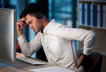Businessman, call center and back pain from burnout, headache or overworked late at night by the...