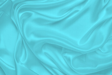 Smooth elegant blue silk or satin luxury cloth texture can use as abstract background. Luxurious Christmas background or New Year background design