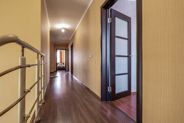 long empty corridor in interior of entrance hall of modern apartments