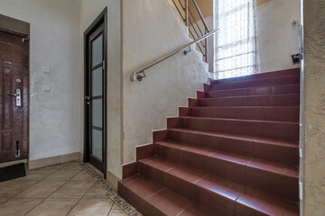 long empty corridor in interior of entrance hall of modern apartments