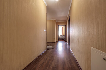 long empty corridor in interior of entrance hall of modern apartments