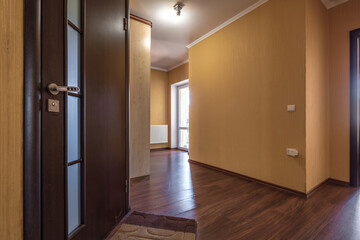 long empty corridor in interior of entrance hall of modern apartments