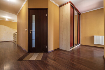 long empty corridor in interior of entrance hall of modern apartments
