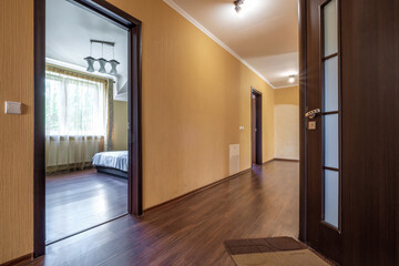 long empty corridor in interior of entrance hall of modern apartments