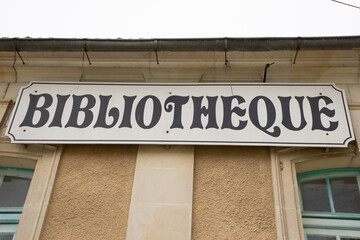 bibliotheque sign french text on facade of Old French Village Building Municipal Library locale in city center