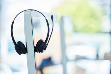 Call center, headset and computer with office background, consulting and technology for crm,...