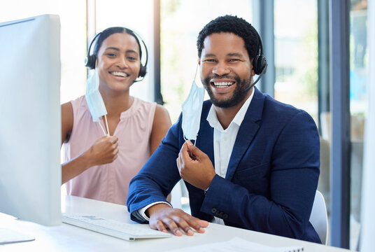 Business People, Call Center And Telemarketing With Smile For Customer Service Or Support In Office. Man And Woman Remove Mask For End Of Covid Business Consultation, Team Advice Or Help On Computer