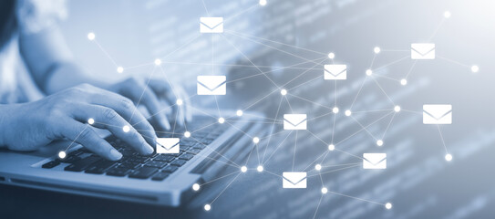 Businesswoman holding smartphone with communication icons, letter icon, email icons, and newsletter email and protect your personal information or spam mail, Customer service call center contact.