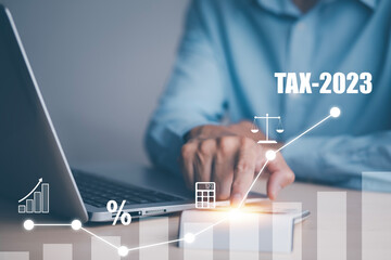 Concept of tax payment optimisation business finance,Man using calculator and taxes icon on technology screen,income tax and property, background for business, individuals and corporations such as VAT