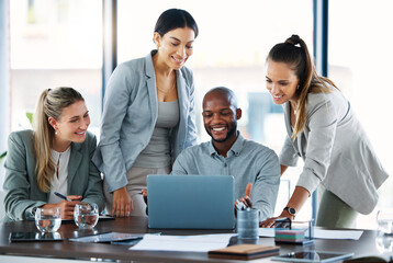 Teamwork, laptop and team working on a project together with research in modern corporate office. Diversity, technology and business people in collaboration on company strategy planning in workplace.