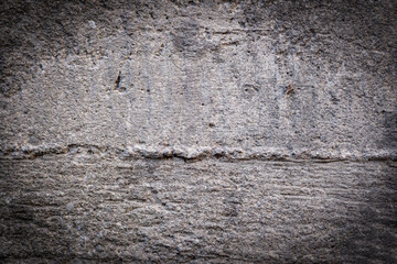 Texture, wall, concrete. Wall fragment with scratches and cracks