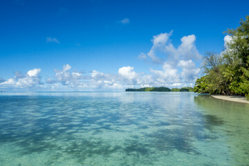 Blue sky with clouds and turquoise colored seawater. The tide is getting lower and then the...