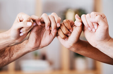 Hands, teamwork and support with a man and woman group holding fingers or thumbs in solidarity....