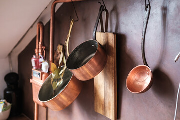 kitchenware and household utensils on kitchen shelves