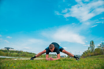 Obraz premium Man strething out muscles before exercise