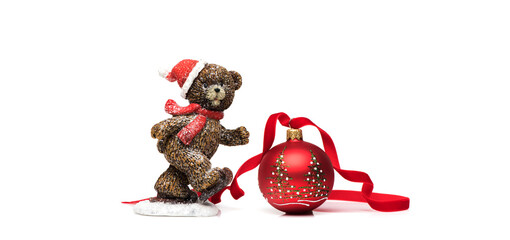 Christmas red ball with ribbon and funny bear on a white background. Merry christmas and happy new year greeting banner
