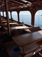 boat interior, wooden restaurant with sea view 