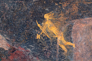Bushmen rock painting of a human figure with a hunting bow and arrow, South Africa.