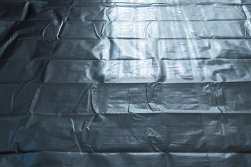 Silver sheet or covering, in light and shadow. often used for hi-tech equipment and thermal...