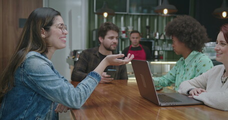 People chatting inside coffee shop business place. Group of friends talking at cafe restaurant