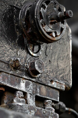 Details of old metal train cars and locomotives.