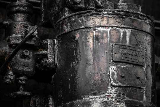 Details of old metal train cars and locomotives.