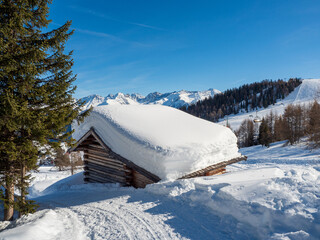 Panoramic view with wood house in winter in resort Ladis, Fiss, Serfaus in ski resort in Tyrol.